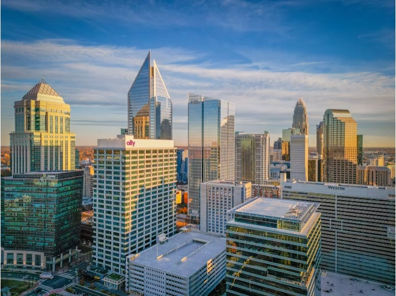 The Charlotte skyline illuminated at sunset
