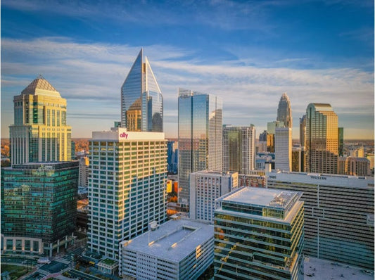 The Charlotte skyline illuminated at sunset